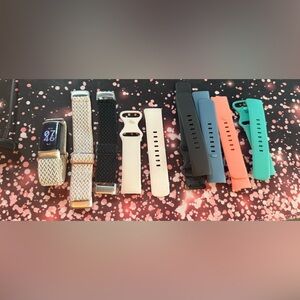 Fitbit Charge 6 and assorted watch bands